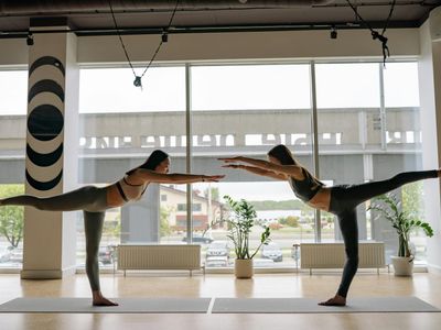 Meditation and balance pose in yoga studio