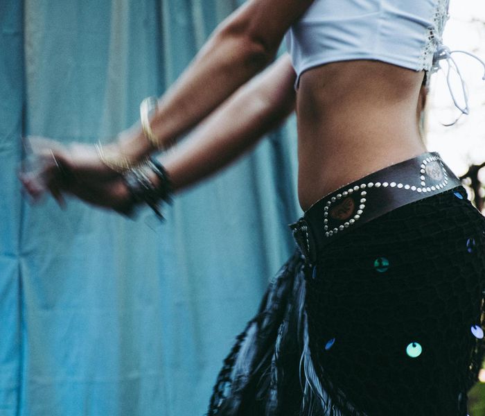 Woman performing a flow of yoga movements with calm expression